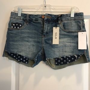 Brand new jean shorts with American flag pocket